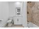 Cozy bathroom with a combined tub and shower, tiled walls, and a vanity with modern fixtures at 2309 Prometheus Ct, Henderson, NV 89074
