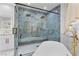Bathroom with a dual shower head, a modern tub, and a marble tiled shower at 2309 Prometheus Ct, Henderson, NV 89074