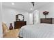 Bedroom with a dresser, ceiling fan, hardwood floors, and cozy furnishings at 2309 Prometheus Ct, Henderson, NV 89074