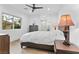 Clean bedroom showcasing neutral tones, hardwood floors, and a ceiling fan at 2309 Prometheus Ct, Henderson, NV 89074
