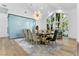 Dining area with large windows, stylish chandelier and seating for ten at 2309 Prometheus Ct, Henderson, NV 89074