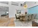 Formal dining room with elegant table, chairs, and statement chandelier at 2309 Prometheus Ct, Henderson, NV 89074