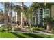 Stunning home exterior featuring lush landscaping and a modern architectural design with large windows at 2309 Prometheus Ct, Henderson, NV 89074