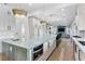 Open-concept kitchen featuring quartz countertops, pendant lighting, and stainless steel appliances, perfect for entertaining at 2309 Prometheus Ct, Henderson, NV 89074