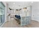 Spacious kitchen with a large marble island, modern appliances, and stylish lighting at 2309 Prometheus Ct, Henderson, NV 89074