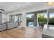 Open living area with sliding glass doors leading to a pool and outdoor seating area at 2309 Prometheus Ct, Henderson, NV 89074