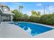 Inviting in-ground pool with a spacious patio and lush landscaping, perfect for outdoor entertaining at 2309 Prometheus Ct, Henderson, NV 89074