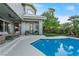 Serene pool area with comfortable seating, covered patio, and views of the well-manicured backyard at 2309 Prometheus Ct, Henderson, NV 89074