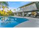 Beautiful backyard with a refreshing pool, shaded patio, and a multi-story home with unique architecture at 2309 Prometheus Ct, Henderson, NV 89074