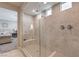 Walk-in shower features dual shower heads and a built-in bench, with bedroom view at 2711 Evolutionary Ln, Las Vegas, NV 89138