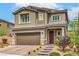 Beautiful two-story home with a well-manicured lawn and attached two-car garage at 2711 Evolutionary Ln, Las Vegas, NV 89138
