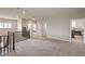 Open loft space with carpeting, neutral walls, and access to multiple bedrooms at 2711 Evolutionary Ln, Las Vegas, NV 89138