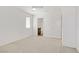 Spacious bedroom with neutral carpet, a window for natural light and an attached bathroom at 2773 Green Envy Ave # 245, North Las Vegas, NV 89086