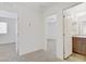 Bright hallway with doorways leading to bathroom and bedrooms at 2773 Green Envy Ave # 245, North Las Vegas, NV 89086