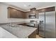 Modern kitchen features stainless steel appliances and granite countertops at 2773 Green Envy Ave # 245, North Las Vegas, NV 89086