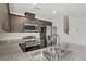 Modern kitchen features stainless steel appliances and granite countertops at 2773 Green Envy Ave # 245, North Las Vegas, NV 89086
