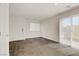 Bright living room features wood floors, a slider to backyard and ample space at 2773 Green Envy Ave # 245, North Las Vegas, NV 89086