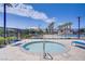 A round, in-ground pool features a stainless-steel railing, and the pool area is surrounded by lounge chairs at 2773 Green Envy Ave # 245, North Las Vegas, NV 89086