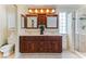 Bathroom with a double sink vanity, and a glass-enclosed shower at 2829 Via Florentine St, Henderson, NV 89074