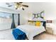 Bright bedroom features a large window, ceiling fan, and modern decor, creating a serene atmosphere at 2829 Via Florentine St, Henderson, NV 89074