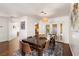Charming dining room with ample natural light and views of the backyard pool through french doors at 2829 Via Florentine St, Henderson, NV 89074