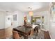 Elegant dining room featuring french doors with views of a pool and backyard oasis at 2829 Via Florentine St, Henderson, NV 89074