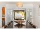 An elegant dining table is set for a gathering, with backyard views seen through the french doors at 2829 Via Florentine St, Henderson, NV 89074