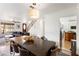 Open-concept space features a large dining table, inviting living area, and staircase at 2829 Via Florentine St, Henderson, NV 89074