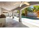 Sparkling pool with lush landscaping, covered patio, and outdoor kitchen at 2829 Via Florentine St, Henderson, NV 89074