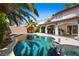 Sparkling pool with tropical landscaping, covered patio, and spa at 2829 Via Florentine St, Henderson, NV 89074