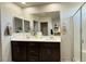 Bathroom featuring a double sink vanity, a glass-enclosed shower, and tile flooring at 2924 Sunday Silence Rd, North Las Vegas, NV 89086