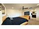 Bright bedroom featuring a ceiling fan, TV, a bed, and connecting ensuite bathroom at 2924 Sunday Silence Rd, North Las Vegas, NV 89086
