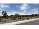 A wide shot of the community with native bushes, plants and trees at 2924 Sunday Silence Rd, North Las Vegas, NV 89086