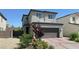 Charming two-story home featuring a two-car garage and well-maintained landscaping at 2924 Sunday Silence Rd, North Las Vegas, NV 89086