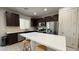 Modern kitchen with stainless steel appliances and a breakfast bar at 2924 Sunday Silence Rd, North Las Vegas, NV 89086