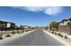Scenic street view in a quiet residential neighborhood with well-kept landscaping at 2924 Sunday Silence Rd, North Las Vegas, NV 89086