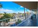 Balcony view showcasing lush landscaping with palm trees and neighborhood streets at 3111 Bel Air Dr # 4B, Las Vegas, NV 89109