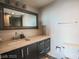 Contemporary bathroom features a sleek vanity with modern fixtures and a large mirror at 3111 Bel Air Dr # 4B, Las Vegas, NV 89109