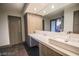 Modern bathroom featuring wood cabinets and drawers with a mirror wall, creating a functional space at 3111 Bel Air Dr # 4B, Las Vegas, NV 89109