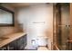 This bathroom features a toilet and a shower to the right of the vanity and mirror at 3111 Bel Air Dr # 4B, Las Vegas, NV 89109