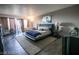 Cozy bedroom with warm lighting, a comfortable bed, and a quaint sitting area at 3111 Bel Air Dr # 4B, Las Vegas, NV 89109