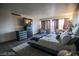 Well-lit bedroom featuring wood floors, neutral tones, a comfortable bed, and a sitting area at 3111 Bel Air Dr # 4B, Las Vegas, NV 89109