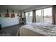 Spacious bedroom with a balcony featuring mountain views and wood flooring throughout at 3111 Bel Air Dr # 4B, Las Vegas, NV 89109