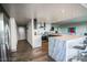 Bright, modern kitchen with stainless steel appliances, marble countertops, and stylish gray and white cabinetry at 3111 Bel Air Dr # 4B, Las Vegas, NV 89109