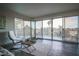 Bright living room with floor-to-ceiling windows that lead to an outdoor balcony with views at 3111 Bel Air Dr # 4B, Las Vegas, NV 89109