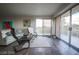 Open living room with floor-to-ceiling windows, showcasing abundant natural light and balcony access at 3111 Bel Air Dr # 4B, Las Vegas, NV 89109