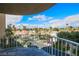 Balcony view showcasing city skyline and lush landscaping with palm trees in Las Vegas at 3111 Bel Air Dr # 4B, Las Vegas, NV 89109