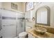 Bathroom featuring a unique vessel sink, decorative mirror, and glass shower door at 3121 Fontana Colony Ct, North Las Vegas, NV 89031