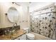Well-lit bathroom featuring a glass vessel sink, shower, and custom vanity at 3121 Fontana Colony Ct, North Las Vegas, NV 89031