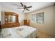 Bedroom featuring a decorative dresser, ceiling fan, and ample natural light at 3121 Fontana Colony Ct, North Las Vegas, NV 89031
